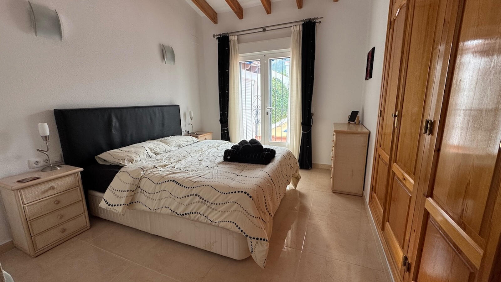 Main ensuite bedroom with direct terrace and pool access