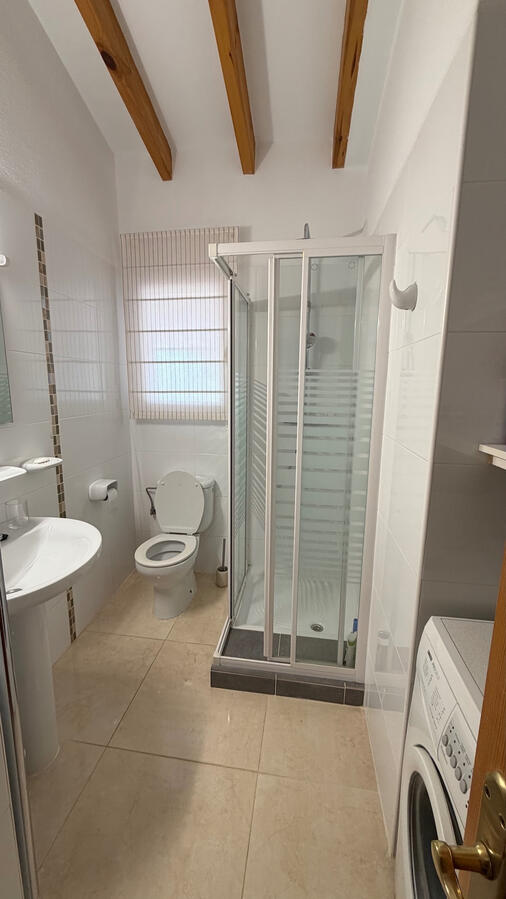 Guest bathroom with washing machine